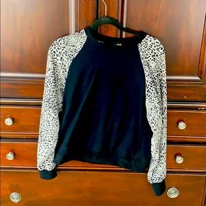 On twelfth cheetah arm sweatshirt
